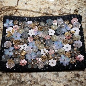 Steve Madden black clutch purse with flower sequin front and black velvet back.